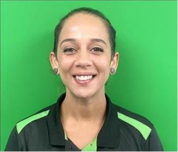 Female employee against green background