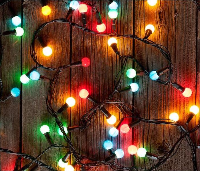 multicolor strand of lights on wood floor