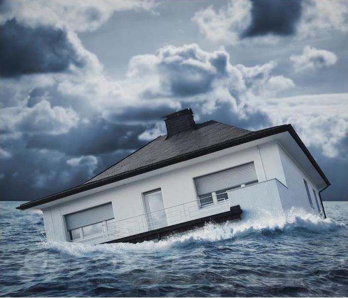 a house floating in a large body of water